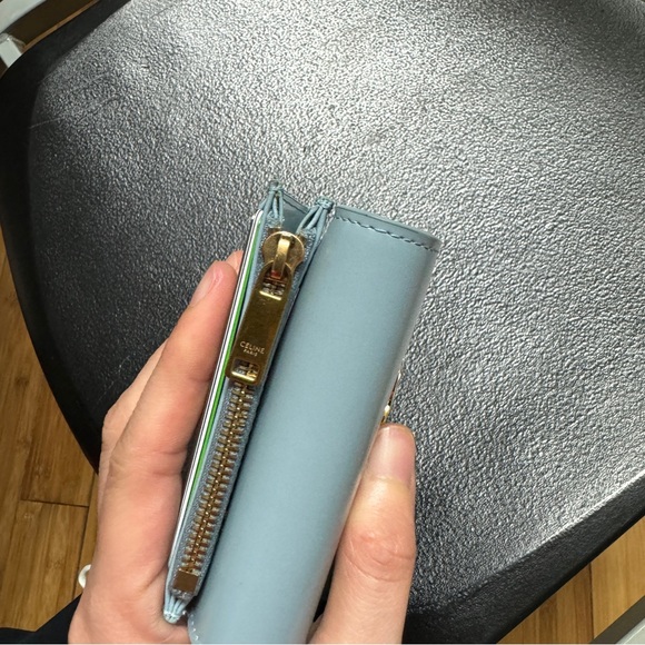 COMPACT WALLET WITH COIN TRIOMPHE IN SHINY CALFSKIN
PALE BLUE. - Picture 9 of 11